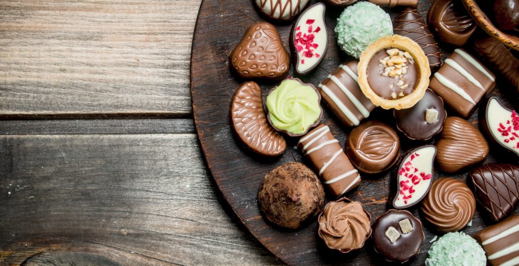 Chocolate sweets on a wooden Board.