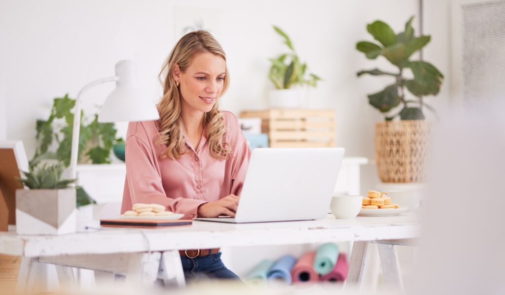 Laptop, business woman and front desk worker writing email, check schedule and appointment at desk.